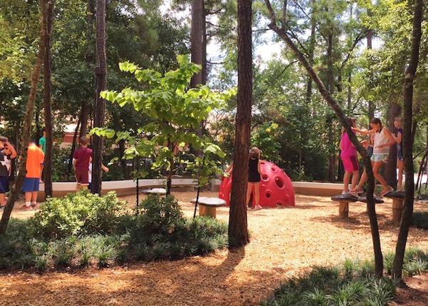 Children playing in the playground at Panther Creek Village. 