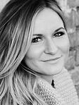 Black and white headshot of Kirsten Blowers
