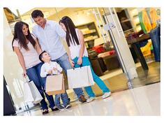 Family with young child shopping in a mall