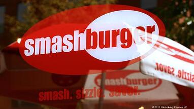 Red and white Smashburger logo on store window