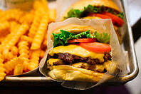 Burger and fries from Shake Shack on a metal tray