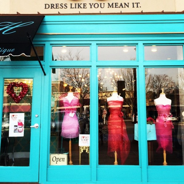 Haley's Boutique storefront and entrance with dresses on display in Raleigh