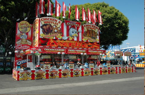 Chicken Charlie store front on a road during a carnival festival