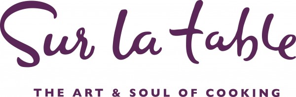 Sur La Table 'the art and soul of cooking' logo in deep purple color