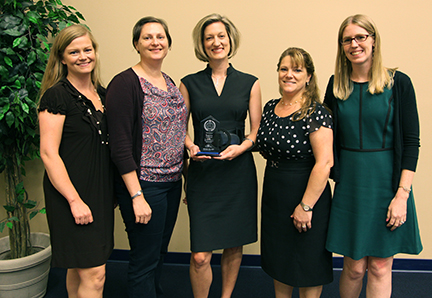 Reese Dowell, Krysta Bonner, Jamie Conroy, Cathy Antonucci and Tara Sikes holding an award for Wellness Program