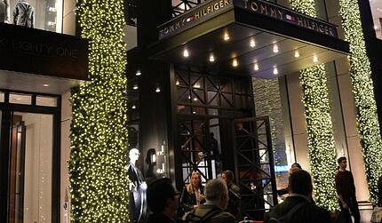 Tommy Hilfiger flagship store on fifth avenue with string lights going up tall columns