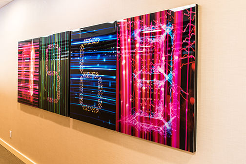 Zac Freeman pieces hanging in the corporate office, signifying the year Regency Centers opened for business