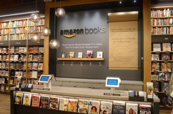 Amazons first retail store featuring a wall of Amazon books