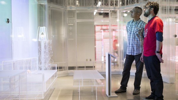Two men looking at a futuristic-looking display in Target's Open House concept store.
