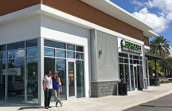 Varick Rosete and Emily Moody having their picture taken outside the store.