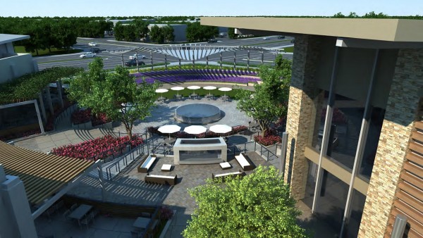 Communal area with trees, flowers and outdoor seating at La Floresta shopping center