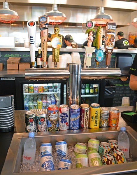 selection of beers and beverages available at burgerfi check out