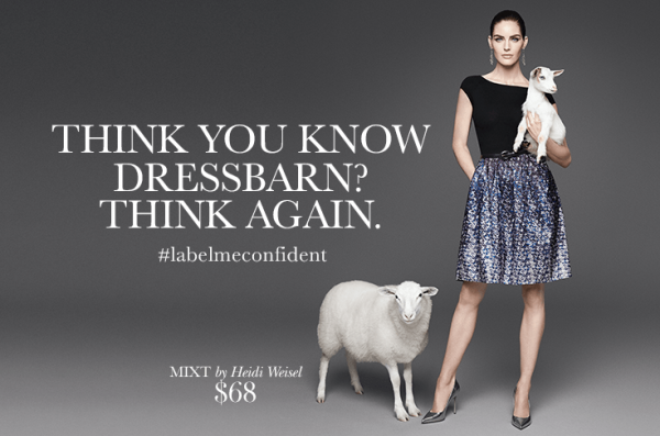 Advertisement for Dressbarn that reads "think you know dressbarn? Think again. #labelmeconfident" with a woman holding a baby goat