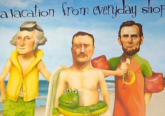 Illustration of George Washington, Abe Lincoln, and Teddy Roosevelt on beach in swimwear