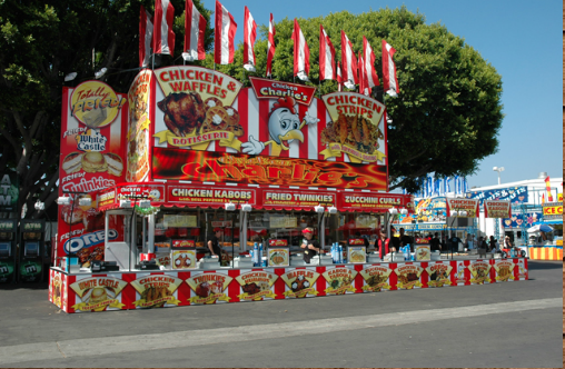 Chicken charlie store front on a road during a carnival festival