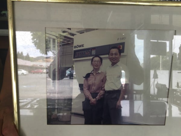 Framed photo of the Varella Cleaners owners. 