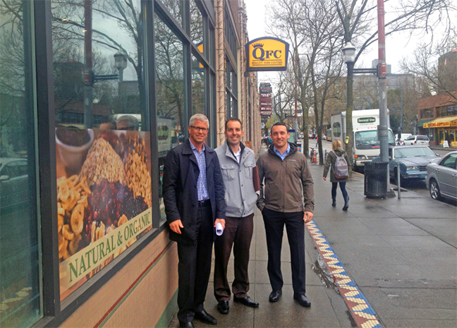 Group Photo of Regency Centers' Craig Ramey, Bret Walton and Kalin Berger outside of Seattle's Broadway Market