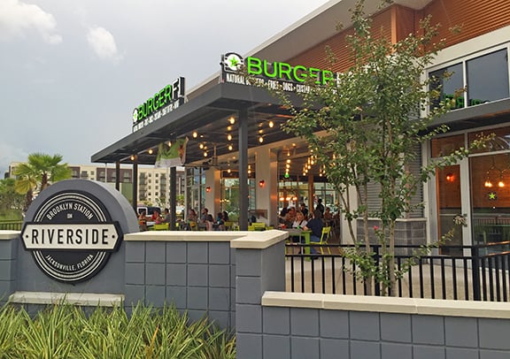 Outside shot of Burgerfi and shopping center signage