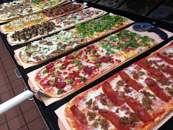 Display of different varieties of flatbread pizzas