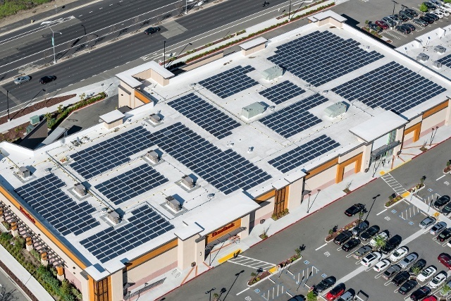Aerial view or the Regency building roof covered with solar panels.