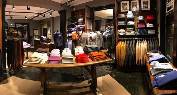 Men's clothing on display inside a Ike Behar store. 