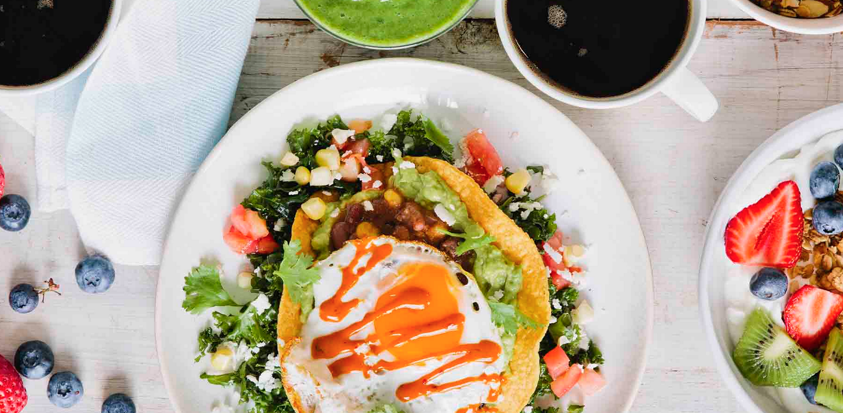 BGood brunch display including a sunny side up egg over a taco bowl