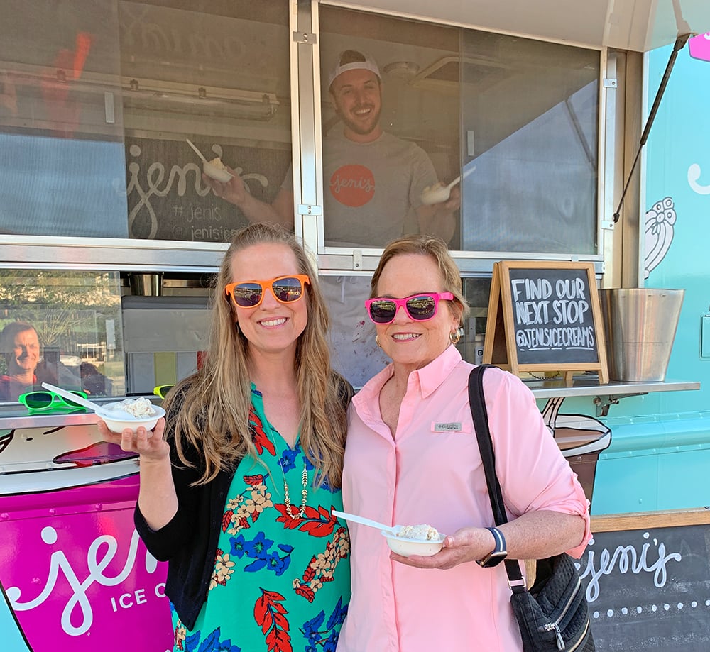 two women enjoying ice cream outside of Jen's ice cream truck