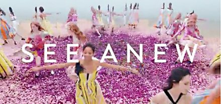 screenshot of Nordstrom ad of women dancing around pile of purple petals