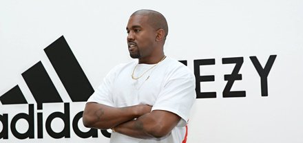 Kayne West looking off-camera at an Adidas-Yeezy event. 