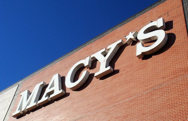 Macy's signage on a red-brick storefront. 