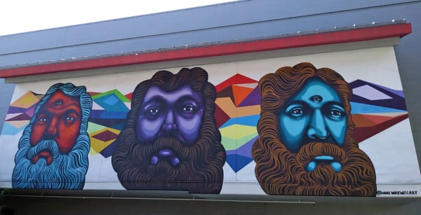 Mural of three bearded men 