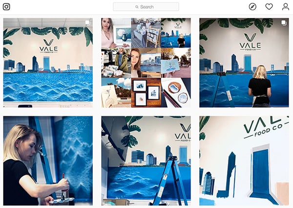 Angelina's progress on an ocean themed mural for VALE Food Co.