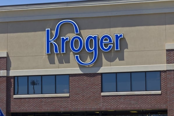 Close-up of Kroger logo on storefront. 