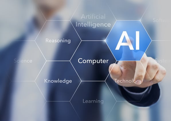 Regency May Blog5.jpg A finger touching the word "AI" on a digital screen