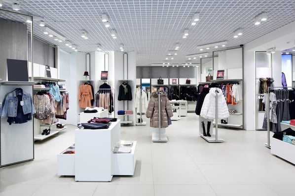 Coats on display in a clothing store. 