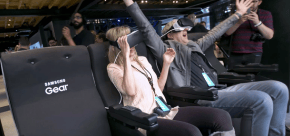 Two shoppers trying out virtual reality headsets. 