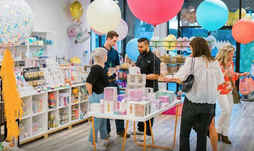 shoppers inside of a party decoration store