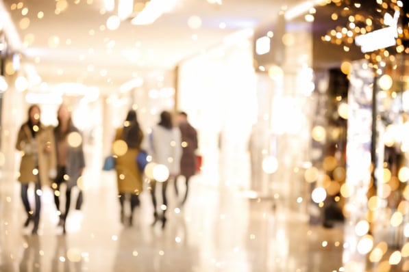 Blurred image of shoppers and lights. 