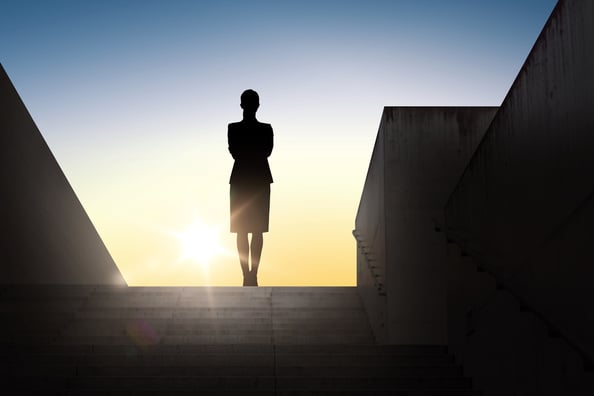 Silhouette of a woman facing the sun. 