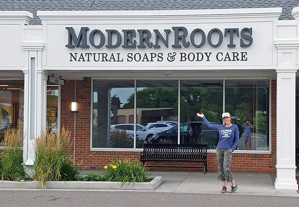 Modern Roots owner standing outside the storefront
